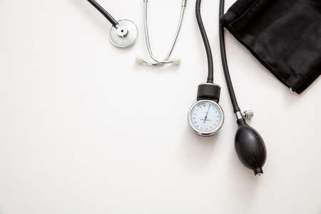 Blood pressure measure equipment, Hypertension control. Medical stethoscope and sphygmomanometer on white color background, top view.の写真素材
