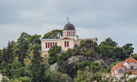 Athens, Greece. National observatory building on a hill, view from Plaka streets