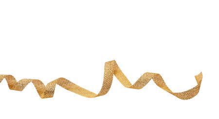 Golden wavy ribbon isolated cutout on white background, glossy curly christmas decoration. Gifts, golden xmas presents concept.の写真素材