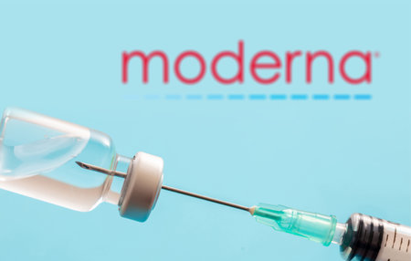 Athens, Greece. December 17, 2020. MODERNA  logo on blue background. Covid19 vaccine vial and syringe, Coronavirus immunization conceptのeditorial素材