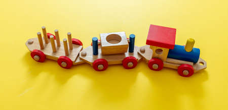 Train children toy, preschool kids game. Locomotive and carriages, wooden colorful blocks...
