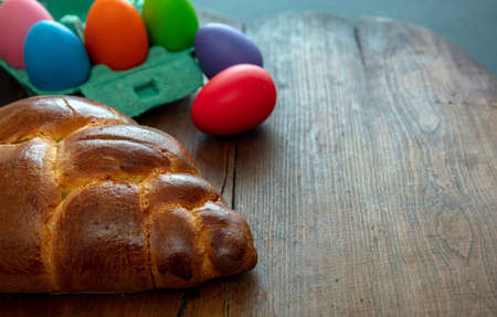Easter greeting card template. Orthodox easter sweet bread and colorful eggs, tsoureki cozonac loaf...