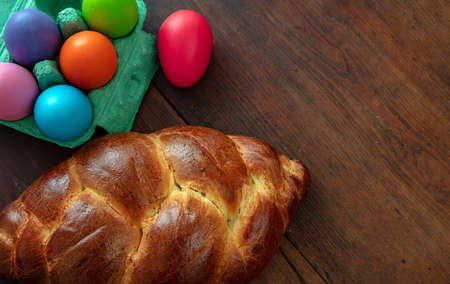 Easter greeting card template. Orthodox easter sweet bread and colorful eggs, tsoureki cozonac loaf...