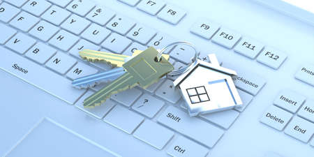 Online real estate concept. Home keys on white computer laptop keyboard background. Advertisement...