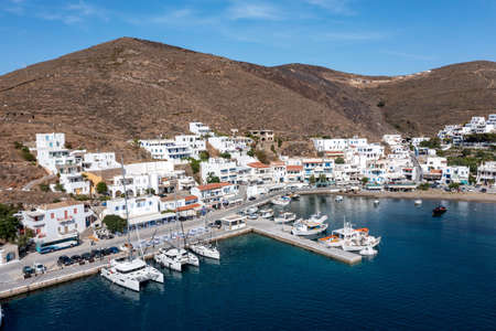 Greece, Kythnos island, Cyclades. May 27, 2021. Merihas port aerial drone view in the morning. Rocky landscape, Cycladic traditional architecture, sailboats at the marina. Calm sea, blue skyのeditorial素材