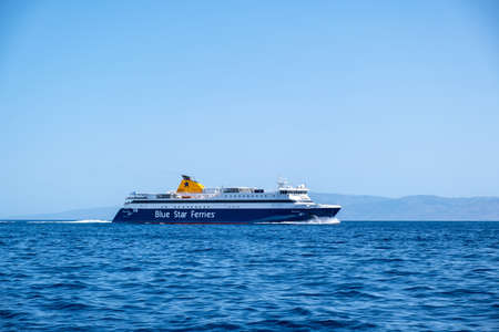 Kythnos island, Cyclades, Greece. May 27, 2021. Ferryboat in endless blue Aegean sea background with destination Greek Kithnos, sunny day. Summer vacation relaxation tourism.のeditorial素材