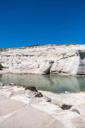 Sarakiniko beach at Milos island, Cyclades Greece. Volcanic white color rock formations, turquoise blue sea and lunar landscape. Summer vacation travel destinationの写真素材