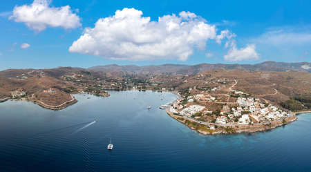 Kea Tzia island. Greece, Cyclades. Drone, aerial view Vourkari marina and Gialiskari village, Blue cloudy sky, rippled sea water background.の写真素材