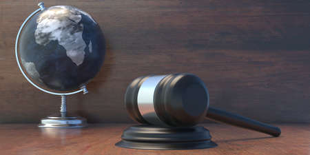 School Globe planet Earth and judge auction gavel on table, International law studies and worldwide laws and legislation concept, 3d illustrationの写真素材
