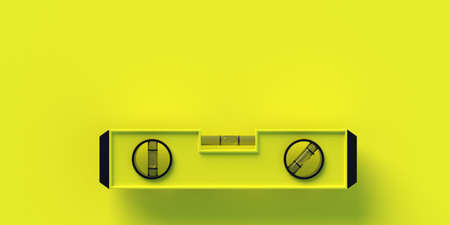 Level instrument isolated on yellow color background. Spirit or bubble level. Construction carpenter...