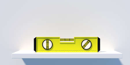Spirit or bubble level on a horizontal wall shelf isolated on white background. Yellow color level...