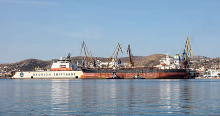 Syros island, Cyclades, Greece. May 27, 2021. Neorion shipyard harbour and industrial plant at...