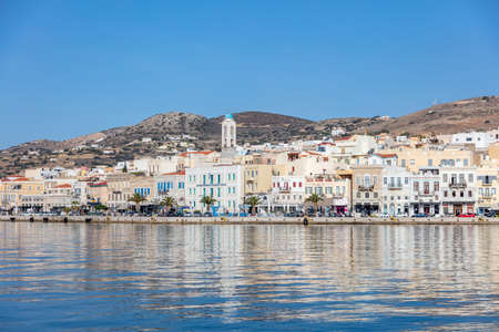 Syros island, Cyclades, Greece. May 27, 2021. Ermoupolis cityscape, waterfront buildings on the coastline, view from the sea. Sunny summer day, blue skyのeditorial素材
