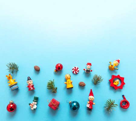 Christmas decoration, baubles and ornaments on blue color background, copy space. Xmas minimal flat...