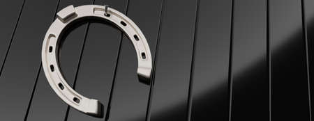 Silver nailed horseshoe isolated on black welded metal pieces empty background. Shiny horse shoe with hole, talisman, fortune. Copy space, banner. 3d illustrationの写真素材