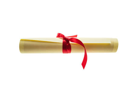Diploma scroll with red ribbon isolated cutout on white background. College degree paper certificate roll, University graduation, education, studies conceptの写真素材