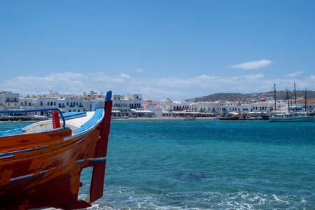 Greece, Mikonos island, destination Cyclades. Mykonos port, waterfront whitewashed building, shop,...