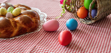 Easter sweet bread, cozonac or tsoureki on table, close up view. Braided brioche, festive...