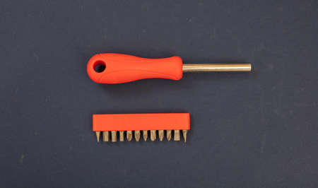 Screwdriver, socket wrench and set of replaceable bit, orange color rubber handle on blue...