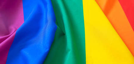 Rainbow colors cloth crease, LGBT Gay pride sign symbol background texture, top view, banner....