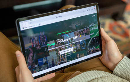 Greece, Athens, January 23 2022. DISNEY HULU ESPN STREAM . Online streaming service of show, movie, sport, news, entertainment app on digital tablet screenのeditorial素材