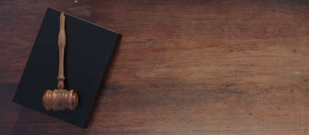 Court table, lawyer office top view. Legal book and judge gavel on wooden desk. Law school,...