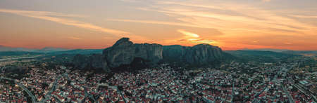 Meteora Greece panorama. Sunset and orange sky over Kalabaka town. Rock formations landscape, Europe travel destinationの写真素材