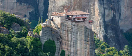 Meteora Greece. Holy Monastery of Rousanos Saint Barbara buildings on top of rocks, Europe religion travel destinationのeditorial素材