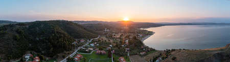Sithonia Chalkidiki, Greece. Sunrise over calm ocean aerial panoramic view. Dramatic sunset seascape...