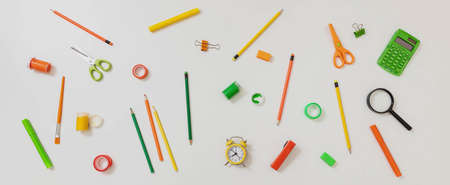 Back to school background. School office supplies and stationery flat lay on white color, top view.