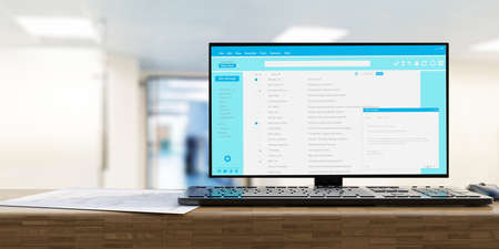 Email message communication. Client mail list on computer desktop monitor. Pc on office desk, blur...