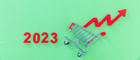 2023 year, Groceries price up, food rising cost. Shopping cart and red arrow up. Financial crisis...