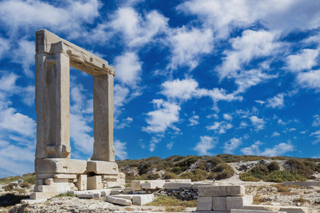 Naxos island, Portara, Greece. Temple of Apollo, Cyclades. Marble pillars gate, Landmark archeology destination.のeditorial素材