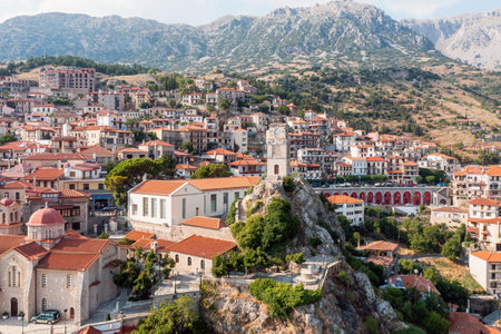 Arachova Greece, Traditional mountain town aerial drone view. Tiled roof houses and stone tower clock, tourist resort in Boeotia.のeditorial素材