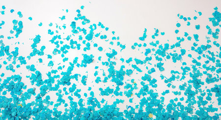 Confetti bright blue scattered on white background. Carnival party, festive decoration, invitation...