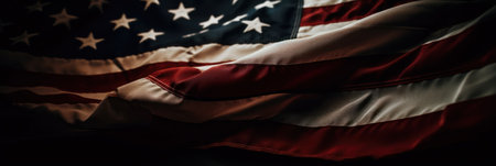 Closeup of ruffled American flag on black background, bannerの素材
