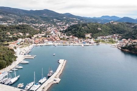 Sailboats anchored in Syvota village marina, aerial drone view. Sailing in Greece, summer vacation destination.のeditorial素材