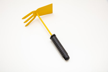Garden hoe rake yellow color isolated on transparent background, view from above,