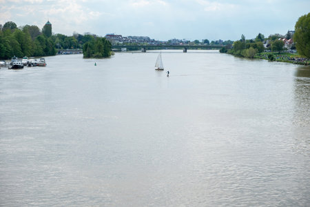 river with sailboat and cityscapeの写真素材