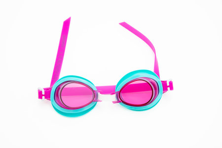Swimming goggles isolated on white background. Blue and pink color swimmer equipmentの写真素材
