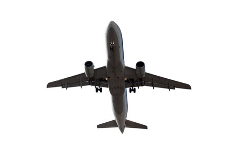 Airplane flying isolated on isolated on white background, under viewの写真素材