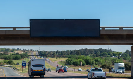 Blank empty billboard mockup template for advertising over a highway in South Africa. Blue skyの写真素材
