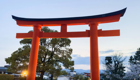 Torii gate in the entrance of Fushimi Inari taisha Grand Shrine at dusk, Kyoto, Japan,の写真素材
