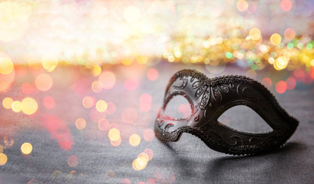 Carnival party. Venetian female mask and bokeh lights, masquerade, mardi grass celebrationの写真素材