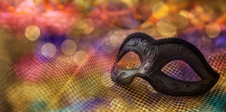 Carnival party. Venetian female mask and bokeh lights, masquerade, mardi grass celebrationの写真素材