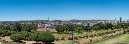 Pretoria city panoramic view from Union Buildings gardens, high rise buildings and blooming jacaranda trees. South Africa.の写真素材
