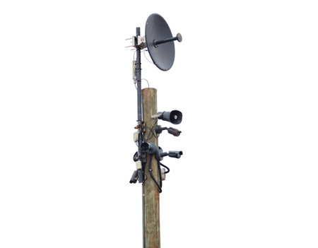 Wooden pole equipped with devices for surveillance and communication isolated on white background