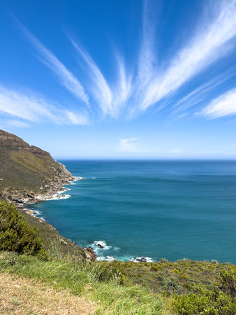 Rocky coast at Hout bay, seaside suburb of Cape Town, South Africa, sunny day, clear blue skyの写真素材