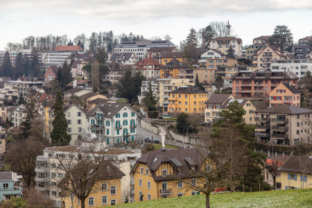 Switzerland, Lucerne, Old town Altstadt, traditional architecture cityscape, clay tiled roofs and cloudy skyの写真素材