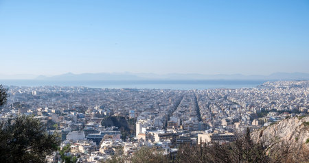 Greece Athens city panoramic view from Philopappos hill. Sunny day blue skyの写真素材